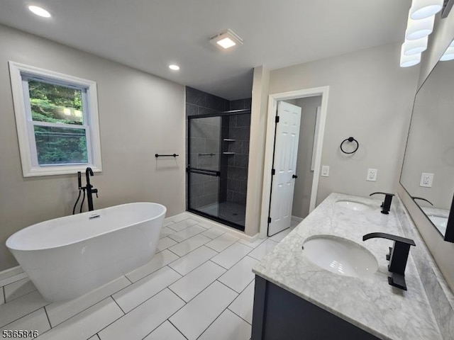 43 Rockport Rd, Wantage Twp, NJ 07461 - bathroom featuring a stall shower, double vanity, a soaking tub, and recessed lighting