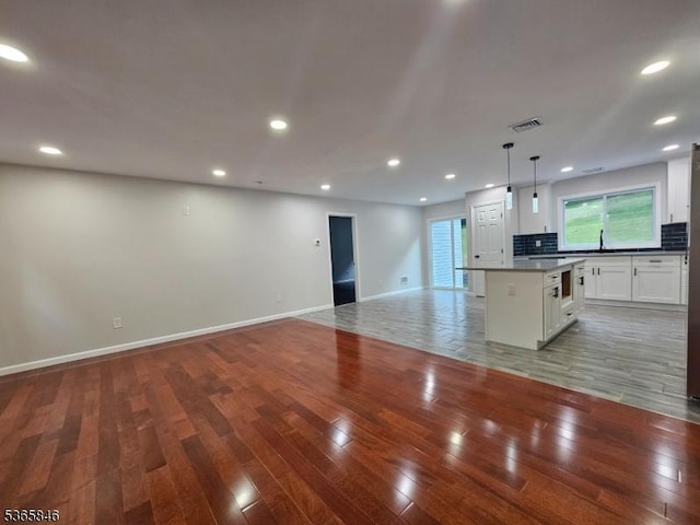 43 Rockport Rd, Wantage Twp, NJ 07461 - unfurnished living room featuring wood finished floors and recessed lighting