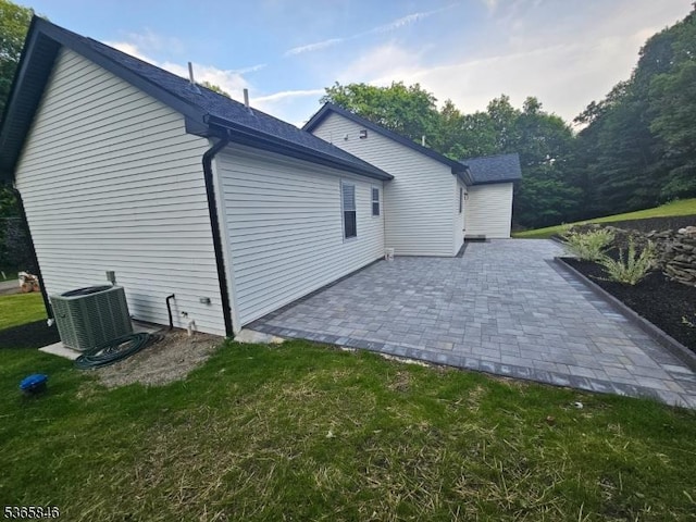 43 Rockport Rd, Wantage Twp, NJ 07461 - view of side of home with a patio, a yard, and roof with shingles