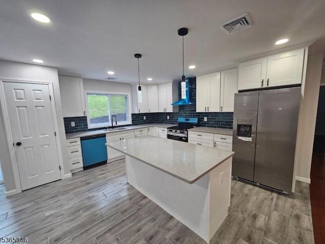 43 Rockport Rd, Wantage Twp, NJ 07461 - kitchen featuring appliances with stainless steel finishes, wall chimney range hood, backsplash, white cabinetry, and recessed lighting
