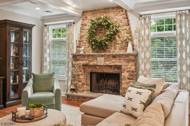 27 Wesley Ct, New Providence Boro, NJ 07974 - living area featuring beamed ceiling, wood finished floors, ornamental molding, a fireplace, and plenty of natural light