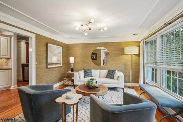27 Wesley Ct, New Providence Boro, NJ 07974 - living area with a chandelier, light wood finished floors, and crown molding