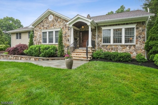 27 Wesley Ct, New Providence Boro, NJ 07974 - ranch-style home with stone siding, a front yard, and a chimney