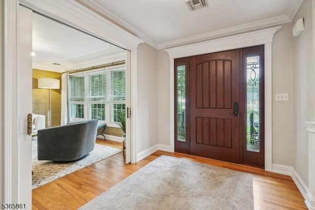 27 Wesley Ct, New Providence Boro, NJ 07974 - foyer entrance with healthy amount of natural light, crown molding, and wood finished floors
