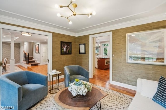 27 Wesley Ct, New Providence Boro, NJ 07974 - living area featuring a chandelier, wood finished floors, stairway, decorative columns, and crown molding