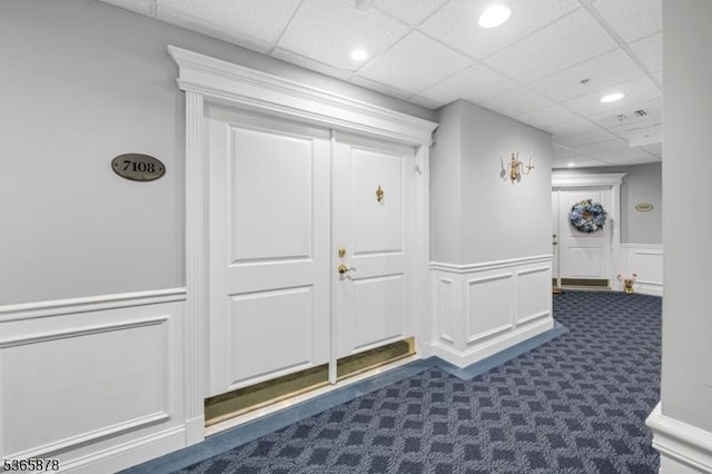 7108 Ravenscroft Rd Unit 7108, Clifton City, NJ 07013 - mudroom featuring a decorative wall, a drop ceiling, wainscoting, dark colored carpet, and recessed lighting