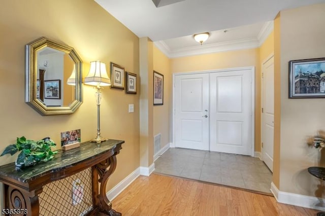 7108 Ravenscroft Rd Unit 7108, Clifton City, NJ 07013 - entrance foyer featuring light wood-type flooring and crown molding