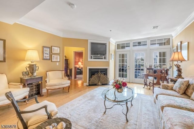 7108 Ravenscroft Rd Unit 7108, Clifton City, NJ 07013 - living room with crown molding, wood finished floors, french doors, and a fireplace