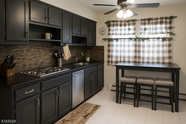 452 W 4th Ave, Roselle Boro, NJ 07203 - kitchen with appliances with stainless steel finishes, open shelves, dark countertops, a ceiling fan, and tasteful backsplash
