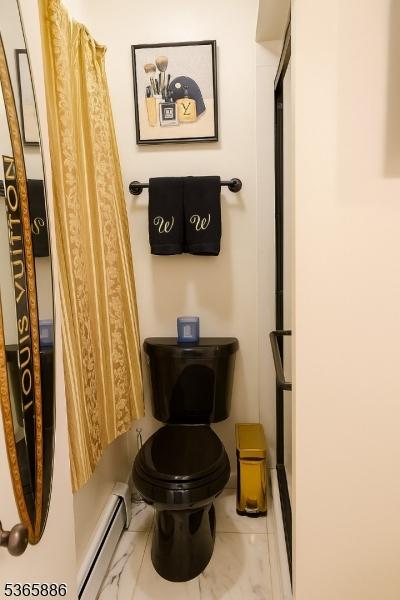 452 W 4th Ave, Roselle Boro, NJ 07203 - bathroom with a baseboard radiator and toilet