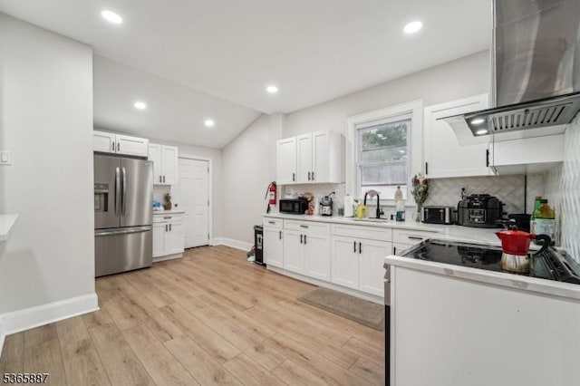 62 Rt46, Mine Hill Twp, NJ 07803 - kitchen with stainless steel refrigerator with ice dispenser, wall chimney exhaust hood, light countertops, backsplash, and white cabinetry