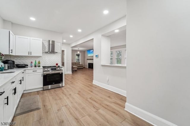 62 Rt46, Mine Hill Twp, NJ 07803 - kitchen with stainless steel range with electric cooktop, wall chimney exhaust hood, light wood-style flooring, light countertops, and recessed lighting