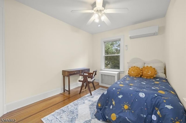 72 Meadowbrook Rd, Millburn Twp, NJ 07078 - bedroom with radiator heating unit, a wall unit AC, wood finished floors, and ceiling fan
