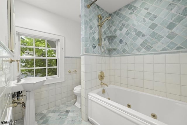 72 Meadowbrook Rd, Millburn Twp, NJ 07078 - bathroom with tile walls, a tub with jets, and tile patterned flooring