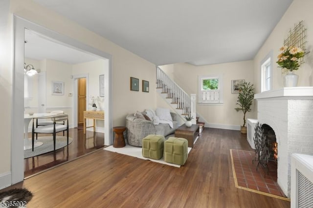 72 Meadowbrook Rd, Millburn Twp, NJ 07078 - living area featuring a fireplace, wood finished floors, and stairs