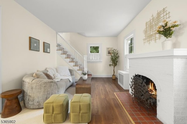 72 Meadowbrook Rd, Millburn Twp, NJ 07078 - living area featuring dark wood-style floors, stairway, and a brick fireplace