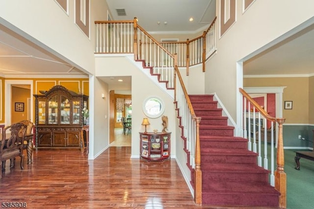 48 Saunders Ln, Mount Olive Twp, NJ 07840 - foyer featuring stairway, wood finished floors, ornamental molding, and a high ceiling