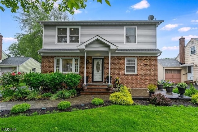 1592 Front St, Scotch Plains Twp, NJ 07076 - view of front facade featuring a front lawn and brick siding