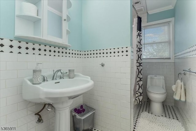 1592 Front St, Scotch Plains Twp, NJ 07076 - bathroom featuring tile walls, crown molding, a shower with shower curtain, tile patterned flooring, and wainscoting