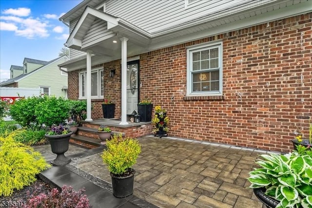 1592 Front St, Scotch Plains Twp, NJ 07076 - property entrance featuring brick siding and a patio