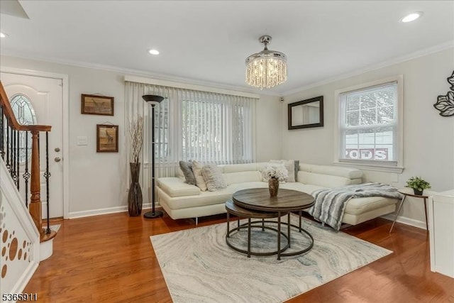1592 Front St, Scotch Plains Twp, NJ 07076 - living room with crown molding, wood finished floors, a chandelier, stairs, and recessed lighting