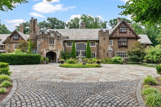 12 Canfield Rd, Morris Twp, NJ 07960 - tudor house with a chimney and stone siding
