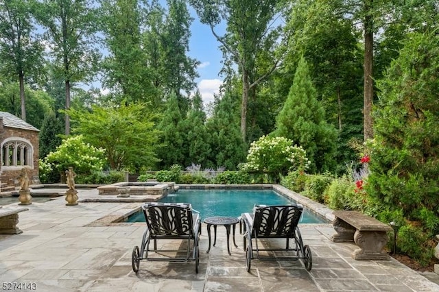 12 Canfield Rd, Morris Twp, NJ 07960 - outdoor pool with a patio area, view of scattered trees, and an in-ground hot tub