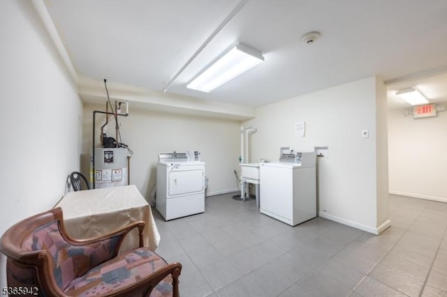 29 E Price St Unit 4, Linden City, NJ 07036 - laundry area with electric water heater, washing machine and clothes dryer, and tile patterned flooring