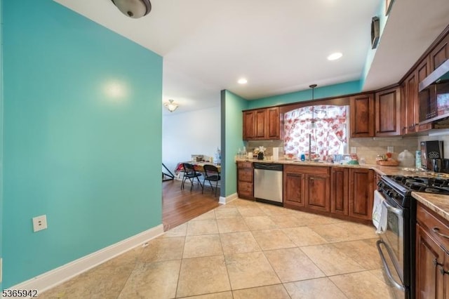 29 E Price St Unit 4, Linden City, NJ 07036 - kitchen featuring appliances with stainless steel finishes, decorative backsplash, light tile patterned floors, decorative light fixtures, and recessed lighting