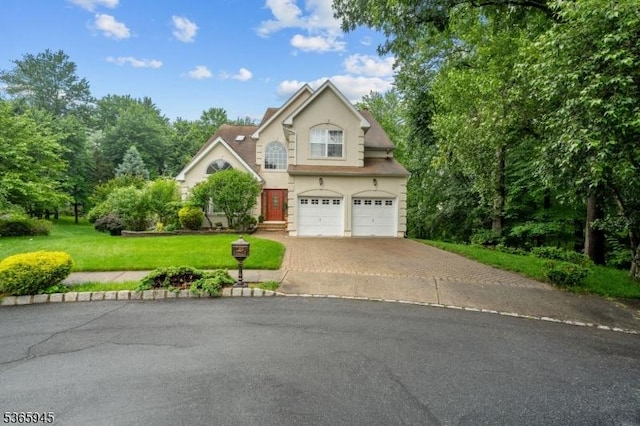 51 Bertran Dr, Bridgewater Twp, NJ 08807 - traditional-style house featuring driveway, a garage, a front lawn, and stucco siding