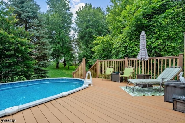 51 Bertran Dr, Bridgewater Twp, NJ 08807 - swimming pool featuring a deck and view of scattered trees