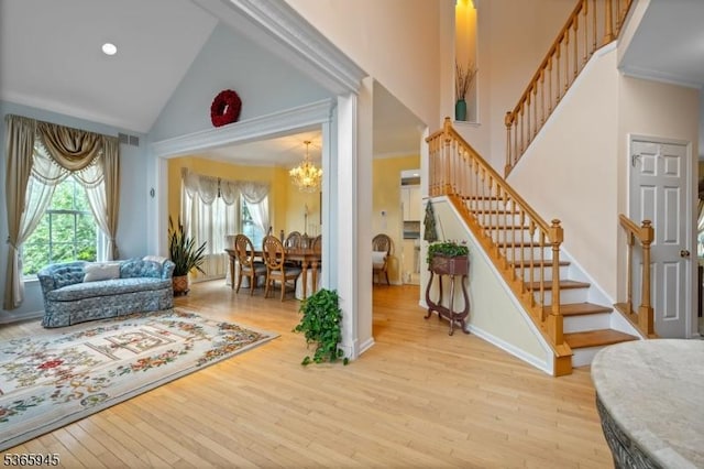 51 Bertran Dr, Bridgewater Twp, NJ 08807 - entryway featuring healthy amount of natural light, high vaulted ceiling, a chandelier, and stairway
