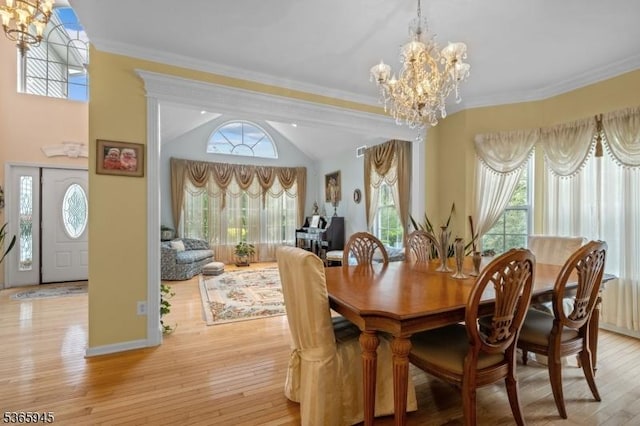 51 Bertran Dr, Bridgewater Twp, NJ 08807 - dining area with a chandelier, plenty of natural light, crown molding, and vaulted ceiling