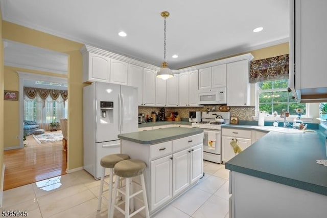 51 Bertran Dr, Bridgewater Twp, NJ 08807 - kitchen with white appliances, white cabinetry, dark countertops, a center island, and tasteful backsplash