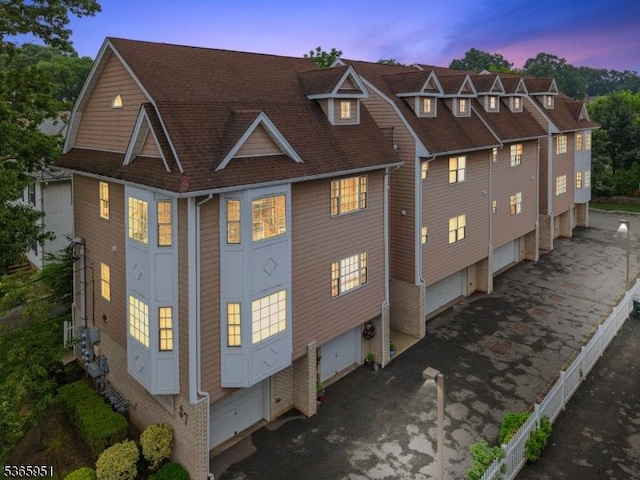 87-02 Centre St Unit 2, Nutley Twp, NJ 07110 - property exterior at dusk with a shingled roof