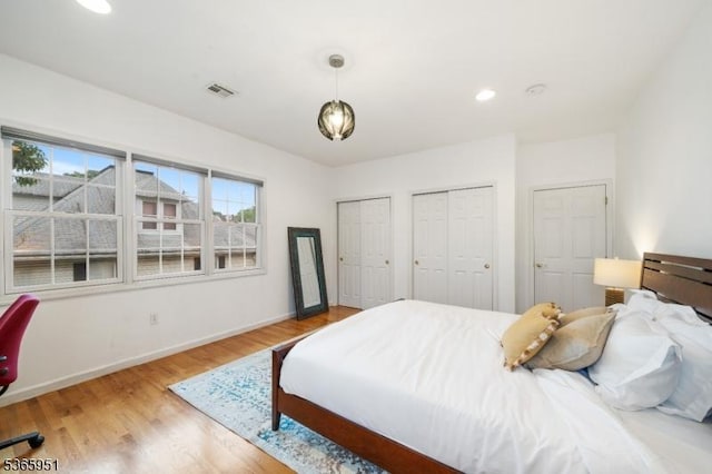 87-02 Centre St Unit 2, Nutley Twp, NJ 07110 - bedroom with two closets, wood finished floors, and recessed lighting