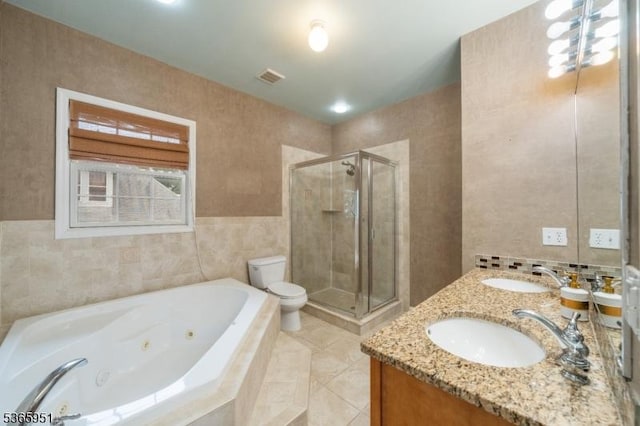 87-02 Centre St Unit 2, Nutley Twp, NJ 07110 - full bath with a whirlpool tub, a stall shower, double vanity, tile walls, and tile patterned flooring