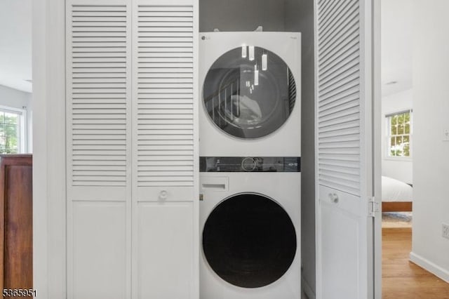 87-02 Centre St Unit 2, Nutley Twp, NJ 07110 - laundry room with stacked washer / drying machine and wood finished floors