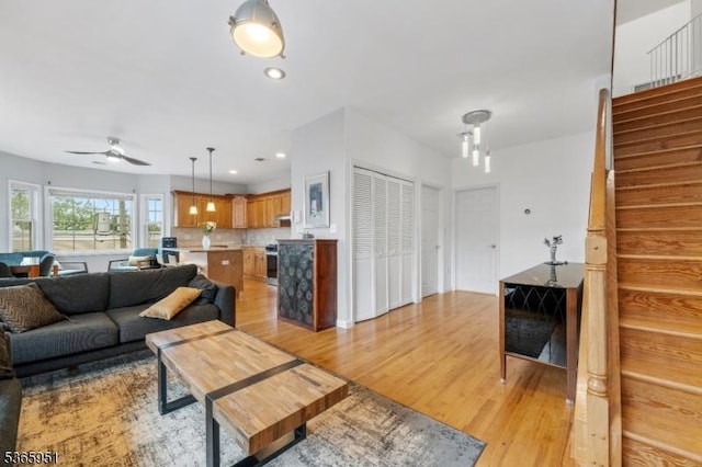 87-02 Centre St Unit 2, Nutley Twp, NJ 07110 - living area with stairway, light wood-type flooring, a ceiling fan, and recessed lighting