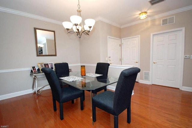 10 Cliff Rd Unit A3, Woodland Park, NJ 07424 - dining area featuring a chandelier, wood finished floors, and ornamental molding