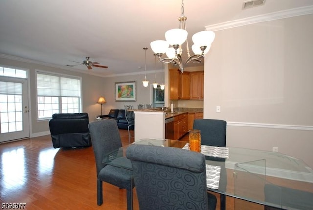10 Cliff Rd Unit A3, Woodland Park, NJ 07424 - dining room with ornamental molding, a chandelier, a ceiling fan, and wood finished floors