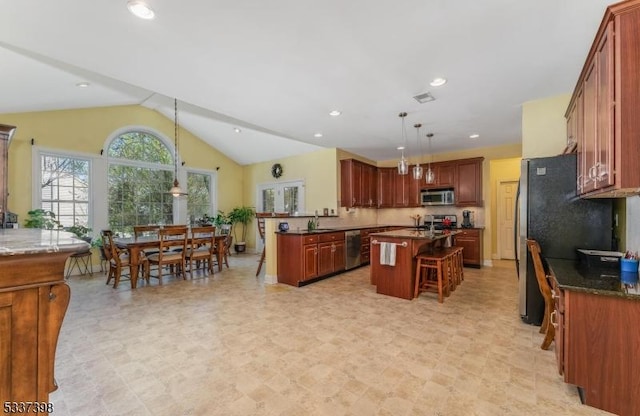 36 Crestview Dr, Clinton Twp, NJ 08809 - kitchen featuring stainless steel appliances, a center island, vaulted ceiling, decorative light fixtures, and a breakfast bar area