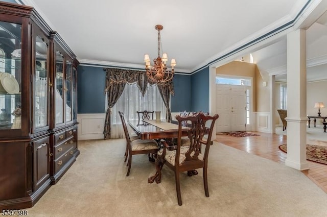 36 Crestview Dr, Clinton Twp, NJ 08809 - dining area with a chandelier, crown molding, a decorative wall, light wood finished floors, and a wainscoted wall