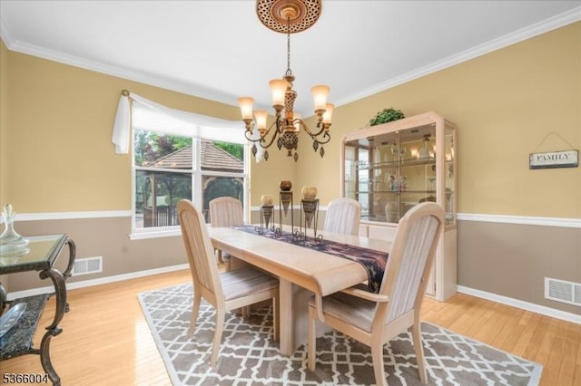 18 Running Brook Cir, Raritan Twp, NJ 08822 - dining room with wood finished floors, a chandelier, and crown molding
