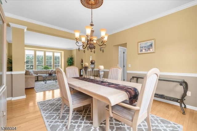 18 Running Brook Cir, Raritan Twp, NJ 08822 - dining room featuring light wood finished floors, ornamental molding, and a chandelier
