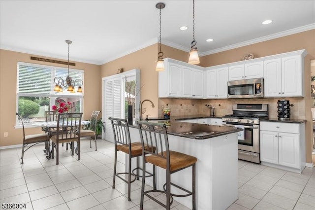 18 Running Brook Cir, Raritan Twp, NJ 08822 - kitchen featuring appliances with stainless steel finishes, dark countertops, backsplash, white cabinetry, and crown molding