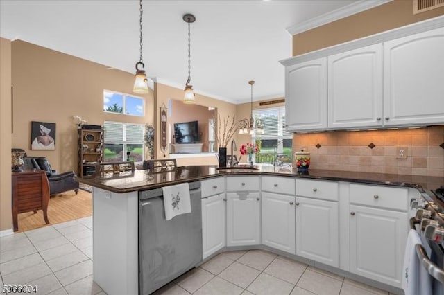 18 Running Brook Cir, Raritan Twp, NJ 08822 - kitchen featuring a peninsula, light tile patterned floors, stainless steel range, ornamental molding, and pendant lighting
