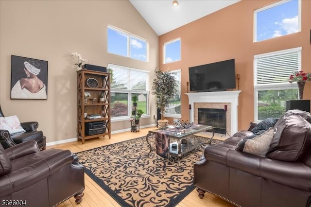 18 Running Brook Cir, Raritan Twp, NJ 08822 - living area with high vaulted ceiling, a fireplace with flush hearth, and wood finished floors