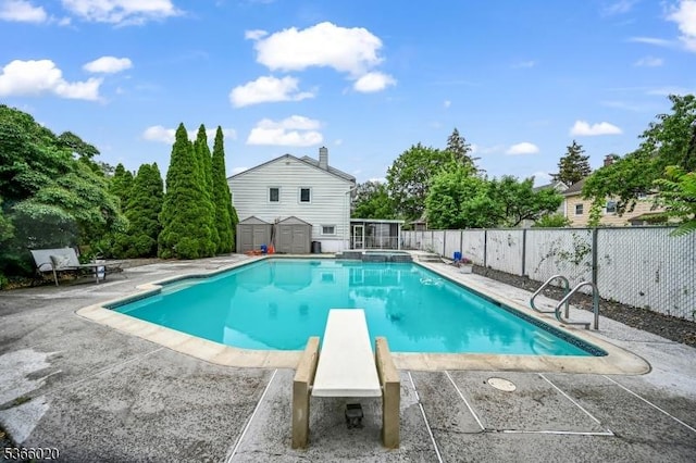 65 Lorraine Dr, Clifton City, NJ 07012 - view of pool with a patio, a storage shed, a pool with connected hot tub, and a diving board