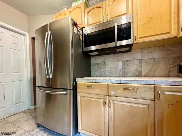 77 Belvidere Ave, Oxford Twp, NJ 07863 - kitchen with stainless steel appliances, light brown cabinets, decorative backsplash, and tile countertops